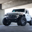 Load image into Gallery viewer, DV8 Offroad 18-23 Jeep Wrangler JL / 20-23 Jeep Gladiator JT FS-7 Mid-Width Winch Front Bumper - Main Product View