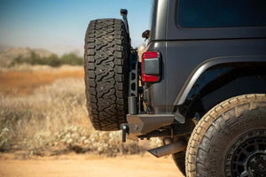 DV8 Offroad 18-23 Jeep Wrangler JL MTO Series Bumper Spare Tire Swing Gate - Main Product View