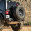 Load image into Gallery viewer, DV8 Offroad 18-23 Jeep Wrangler JL MTO Series Bumper Spare Tire Swing Gate - Installation View