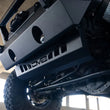 Load image into Gallery viewer, DV8 Offroad 18-23 Jeep Wrangler JL/JT Front Bumper Sway-Bar Disconnect Motor Skid Plate - Additional View 13