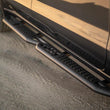 Load image into Gallery viewer, DV8 Offroad 19-24 GMC Sierra 1500 Crew Cab OE Plus Side Steps - Black Steel - Installation View