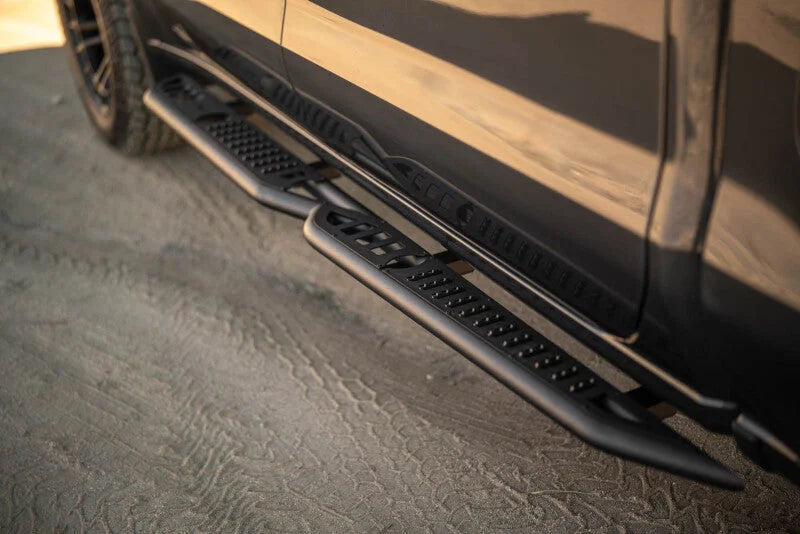 DV8 Offroad 19-24 GMC Sierra 1500 Crew Cab OE Plus Side Steps - Black Steel - Installation View