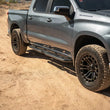Load image into Gallery viewer, DV8 Offroad 19-24 GMC Sierra 1500 Crew Cab OE Plus Side Steps - Black Steel - Additional View 7