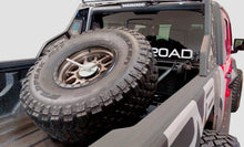Load image into Gallery viewer, DV8 Offroad 2019+ Jeep Gladiator In-Bed Adjustable Tire Carrier - Side View