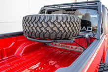 Load image into Gallery viewer, DV8 Offroad 2019+ Jeep Gladiator In-Bed Adjustable Tire Carrier - Additional View 6