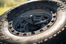Load image into Gallery viewer, DV8 Offroad 2020+ Jeep Gladiator JT Adjustable In-Bed Tire Carrier - Installation View