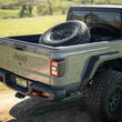 Load image into Gallery viewer, DV8 Offroad 2020+ Jeep Gladiator JT Adjustable In-Bed Tire Carrier - Additional View 13