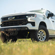 Load image into Gallery viewer, DV8 Offroad 2022+ Chevrolet Silverado 1500 Offroad Spec Series Front Bumper w/ Winch - Installation View