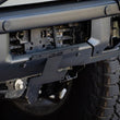 Load image into Gallery viewer, DV8 Offroad 21-22 Ford Bronco Factory Front Bumper Licence Relocation Bracket - Front - Installation View