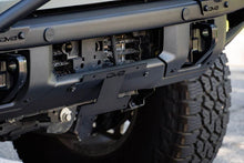 Load image into Gallery viewer, DV8 Offroad 21-22 Ford Bronco Factory Front Bumper Licence Relocation Bracket - Front - Installation View