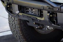 Load image into Gallery viewer, DV8 Offroad 21-22 Ford Bronco Factory Front Bumper Licence Relocation Bracket - Front - Additional View 6