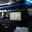 Load image into Gallery viewer, DV8 Offroad 21-22 Ford Bronco Factory Front Bumper License Relocation Bracket - Side - Additional View 7