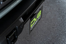 Load image into Gallery viewer, DV8 Offroad 21-23 Ford Bronco Capable Bumper Front License Plate Mount - Back View