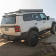 Load image into Gallery viewer, DV8 Offroad 24-25 Toyota Land Cruiser OE Plus Side Steps - Black Steel - Installation View