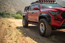 Load image into Gallery viewer, DV8 Offroad 24-25 Toyota Tacoma Double Cab Rock Sliders - Installation View