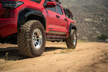 Load image into Gallery viewer, DV8 Offroad 24-25 Toyota Tacoma Double Cab Rock Sliders - Additional View 10