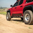 Load image into Gallery viewer, DV8 Offroad 24-25 Toyota Tacoma Double Cab Rock Sliders - Additional View 12