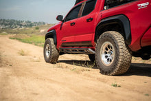 Load image into Gallery viewer, DV8 Offroad 24-25 Toyota Tacoma Double Cab Rock Sliders - Additional View 12