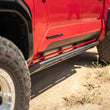 Load image into Gallery viewer, DV8 Offroad 24-25 Toyota Tacoma Double Cab Rock Sliders - Additional View 14