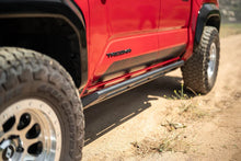 Load image into Gallery viewer, DV8 Offroad 24-25 Toyota Tacoma Double Cab Rock Sliders - Additional View 14