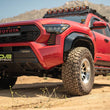 Load image into Gallery viewer, DV8 Offroad 24-25 Toyota Tacoma Double Cab Rock Sliders - Additional View 15