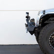 Load image into Gallery viewer, DV8 Offroad Fairlead Mounted Flip-Up License Plate Bracket - Additional View 7