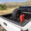 Load image into Gallery viewer, DV8 Offroad Truck Bed Universal Tire Carrier &amp; Accessory Mount - Back View