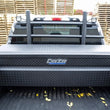 Load image into Gallery viewer, Deezee 09-23 Dodge/Ram Ram Cargo Management Cab Rack (Txt Blk) - Side View