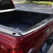 Load image into Gallery viewer, Deezee 09-23 Dodge/Ram Ram Tailgate Protector Cap Black-Tread - Side View
