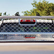 Load image into Gallery viewer, Deezee 99-16 Ford SuperDuty Cargo Management Cab Rack - Aluminum Mesh - Side View