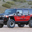 Load image into Gallery viewer, Fabtech 03-05 Hummer H2 Suv/Sut 4WD w/Rr Air Bags 6in Perf Sys w/Perf Shks - Side View