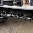 Load image into Gallery viewer, Fabtech 05-21 Ford F250/350 4WD Dual Steering Stabilizer System (Opposing Style) w/DL 2.25 Res Shock - Side View
