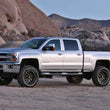 Load image into Gallery viewer, Fabtech 11-19 GM 2500HD 2WD/4WD 4in Basic Sys w/Perf Shks - Side View