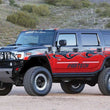 Load image into Gallery viewer, Fabtech 6in Performance System - Component Box 2 - Black fits 2003-2009 Hummer H2 4WD