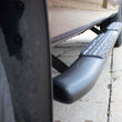 Load image into Gallery viewer, Fishbone Offroad 09-14 Ford F150 Extended Super Cab Oval Side Steps - Black Textured - Back View