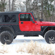 Load image into Gallery viewer, Fishbone Offroad 97-06 Jeep Wrangler Steel Tube Fender Front/Rear - Blk Txtred Pwdercoat (Set Of 4) - Installation View