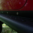 Load image into Gallery viewer, Fishbone Offroad 97-06 Jeep Wrangler TJ Steel Rock Slider - Black Textured Powdercoat - Additional View 8