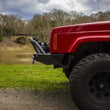Load image into Gallery viewer, Fishbone Offroad Cherokee XJ Front Winch Bumper W/Grille Guard Bullhead Steel - Blk Txtrd Pwdrcoat - Side View