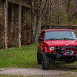 Load image into Gallery viewer, Fishbone Offroad Cherokee XJ Front Winch Bumper W/Grille Guard Bullhead Steel - Blk Txtrd Pwdrcoat - Back View
