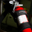 Load image into Gallery viewer, Fishbone Offroad Padded Roll Bar Black Fire Extinguisher Holder - Installation View