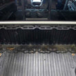 Load image into Gallery viewer, Fishbone Offroad Tacoma Front Bed Wheel Chock - Installation View