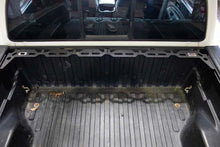 Load image into Gallery viewer, Fishbone Offroad Tacoma Front Bed Wheel Chock - Installation View