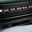 Load image into Gallery viewer, Ford Racing 2021+ Bronco Grille Lettering Overlay Kit - Bronze - Back View
