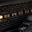 Load image into Gallery viewer, Ford Racing 2021+ Bronco Grille Lettering Overlay Kit - Bronze - Installation View