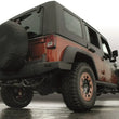 Load image into Gallery viewer, Gibson 07-17 Jeep Wrangler JK Rubicon 3.6L 2.5in Axle-Back Dual Split Exhaust - Aluminized - Side View