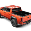 Load image into Gallery viewer, Go Rhino 2024 Toyota Tacoma DC 4dr Xtreme Frame Mount Sliders - Tex. Blk - Side View