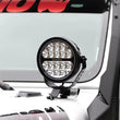Load image into Gallery viewer, Go Rhino Xplor Blackout Series Round LED Spot Light Beam w/DRL (Surface/Thread Stud Mnt) 7in. - Blk - Installation View