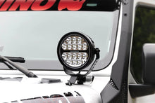 Load image into Gallery viewer, Go Rhino Xplor Blackout Series Round LED Spot Light Beam w/DRL (Surface/Thread Stud Mnt) 7in. - Blk - Installation View