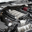 Load image into Gallery viewer, Grams Performance 11-18 Ford Mustang 5.0L Coyote Fuel Rail - Black - Side View