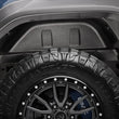 Load image into Gallery viewer, Husky Liners 19-23 GMC Sierra 1500 Black Rear Wheel Well Guards - Installation View